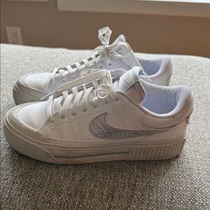 Nike White Sneakers with Metallic Swoosh